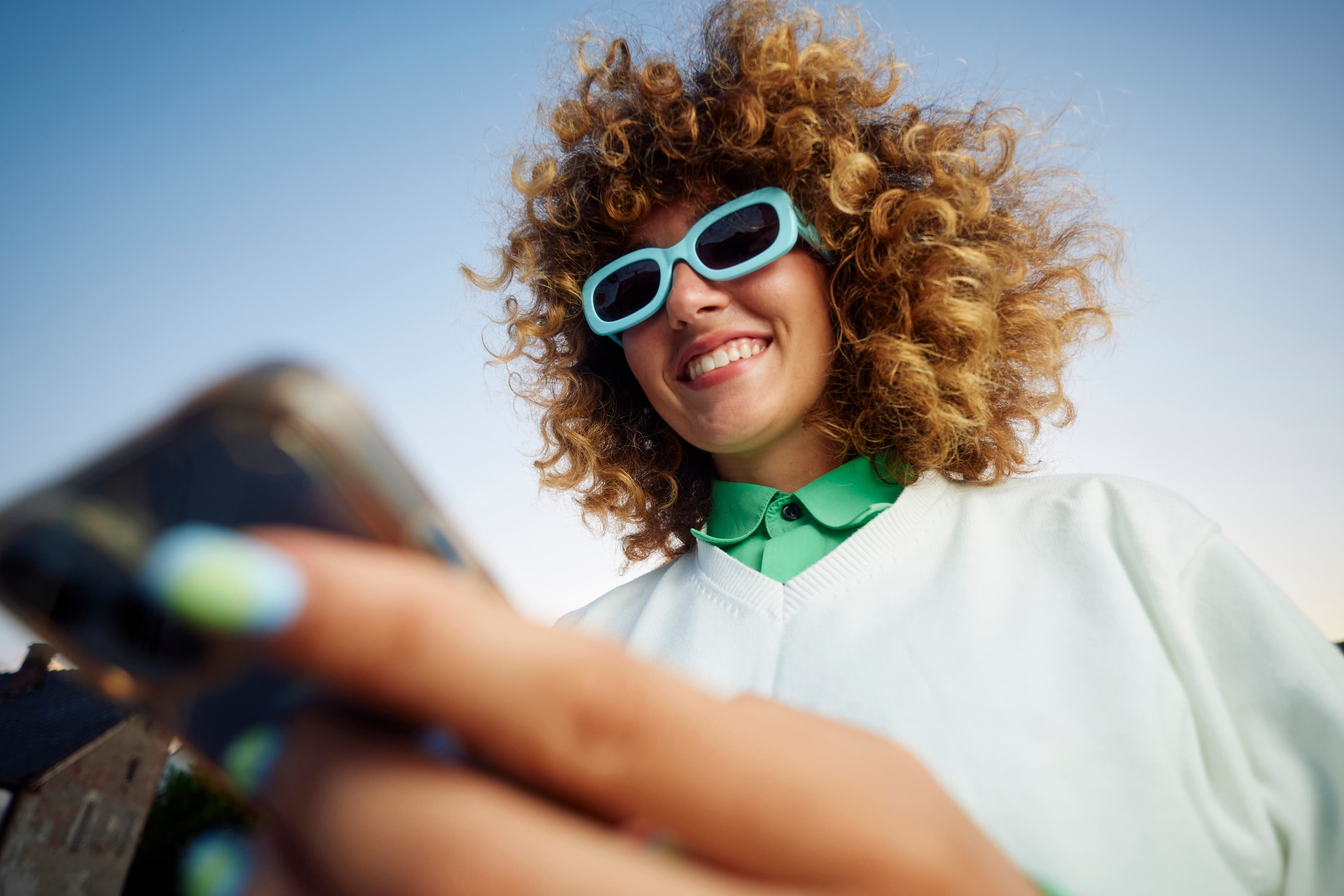 Man laughing at a phone
